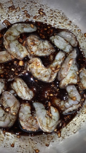 Shrimp marinating in garlic sauce